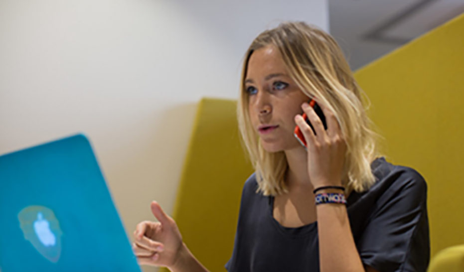 A woman working on the phone